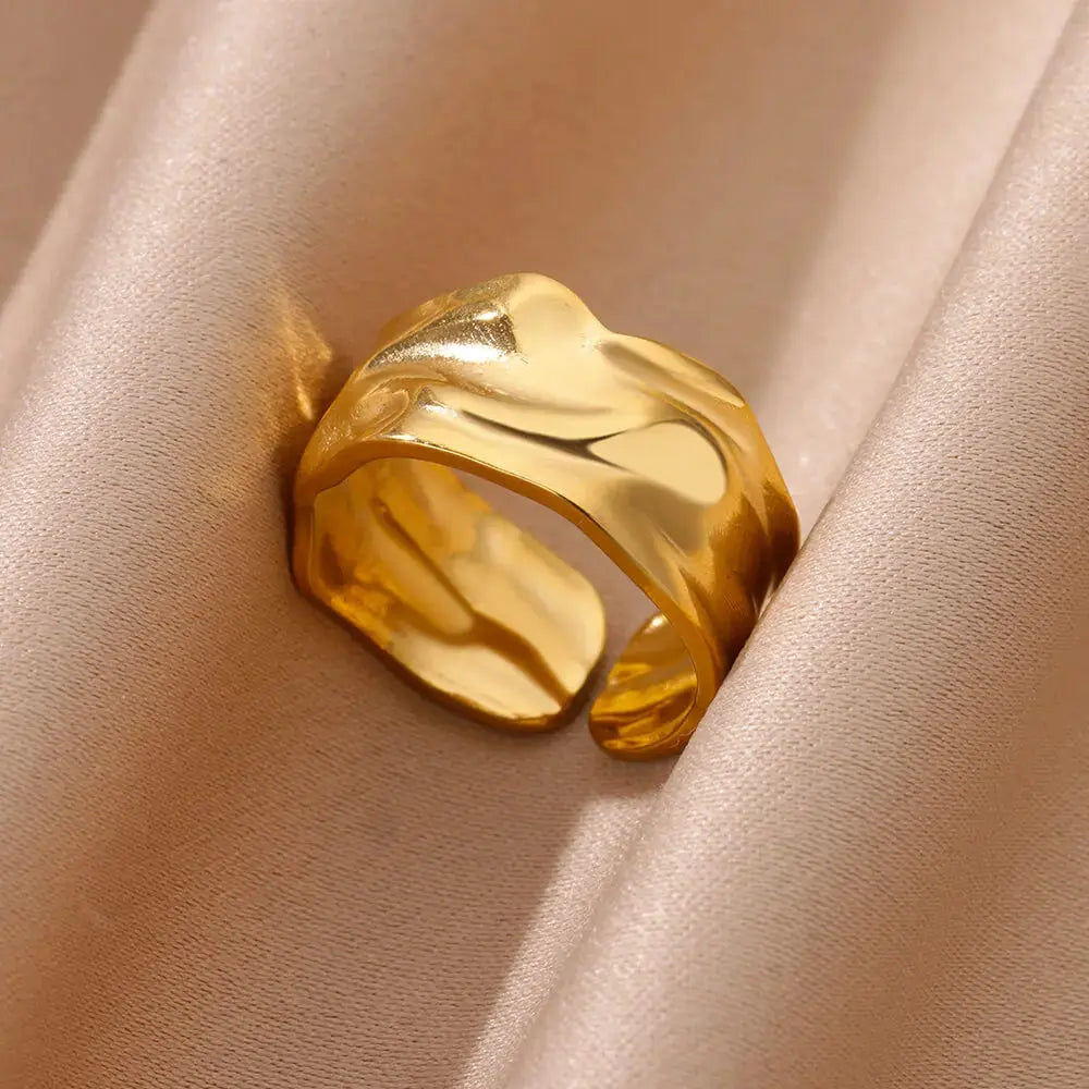 Irregular Geometric Gold Ring – Chunky Adjustable Opening Ring showcasing a unique chunky design on a soft fabric backdrop.