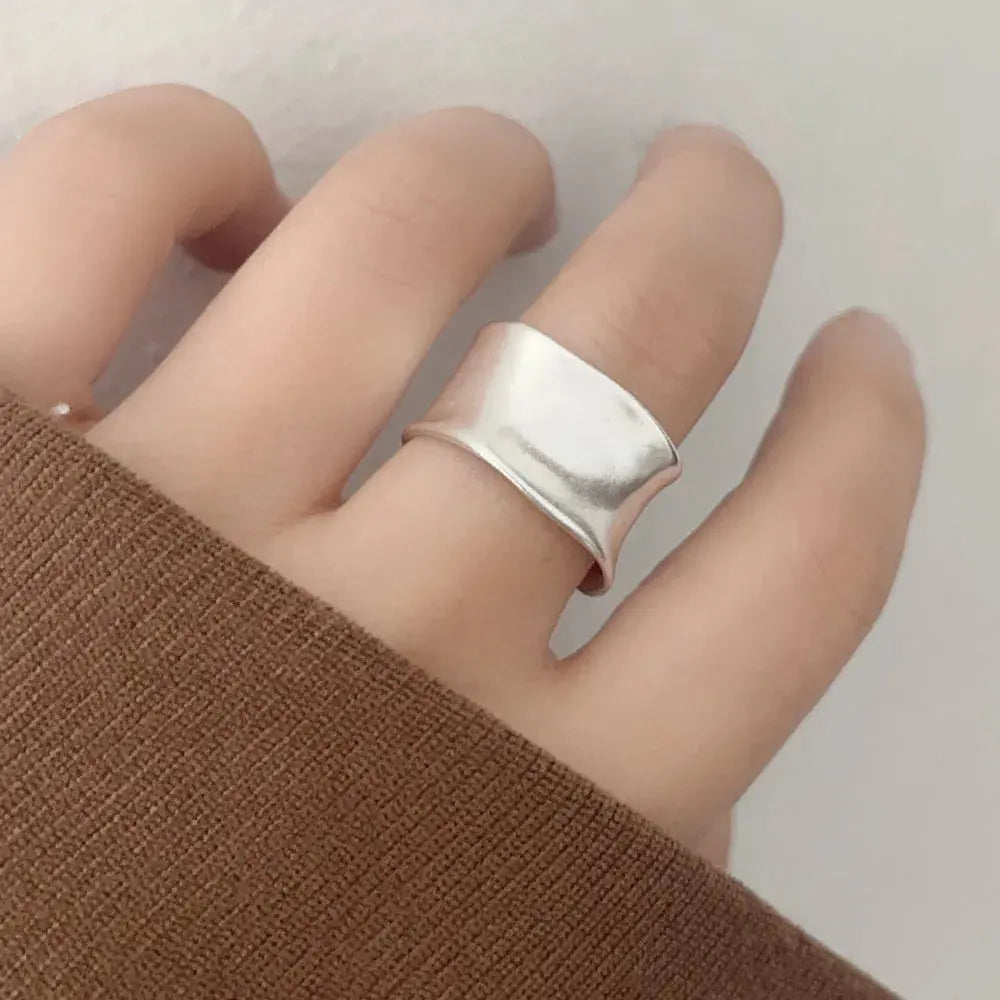Open Vintage Sterling Silver Ring shown on hand, featuring a wide flat band and sleek design, perfect for stylish occasions.