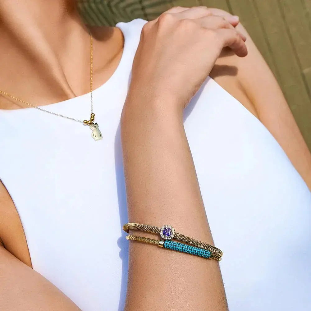 Vintage stainless steel jewelry set featuring gold tone bracelets with turquoise and purple accents